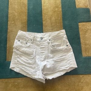 White ripped jean shorts